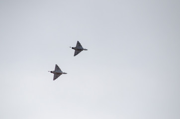 Fototapeta na wymiar Delta wing couple of jet fighter down view unarmed 