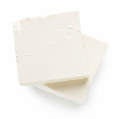 Pieces of Feta cheese on white