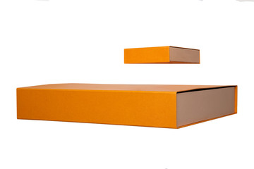 Gift box isolated. Close-up of two orange gift boxes or cardboard boxes isolated on a white background. Gift box template.