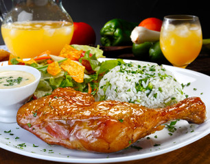 Grilled chicken thigh with garnishes
