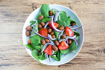 healthy dinner salad bowl of garden greens and bean protein