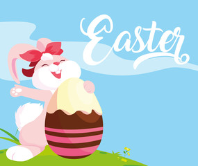 female rabbit and egg of easter decorated with candy