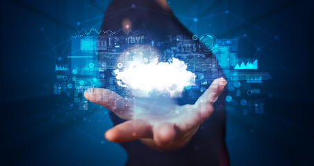 Person holding hologram screen displaying information from cloud based system
