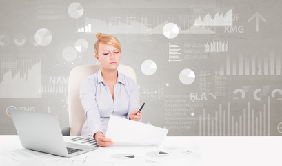 Business person sitting at desk with financial change, and report diagram concept

