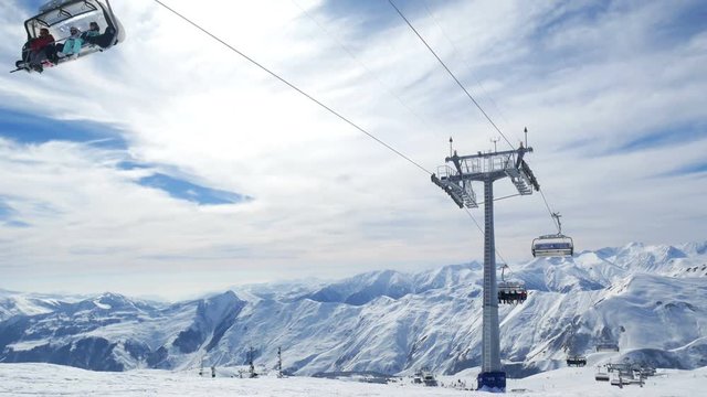 Mountain winter ski lift sun