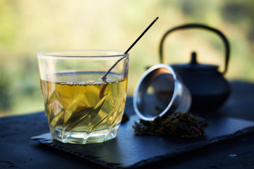 Infused green tea in glass tumbler