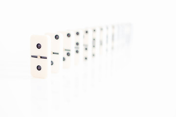 domino tiles in a row on white background in Hi key