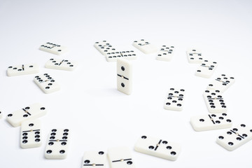 Concept of the leader with domino tiles falling in a circle and one standing