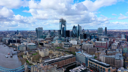 Obraz premium Aerial drone panoramic view of iconic financial and bank district with tall skyscrapers in City of London, United Kingdom