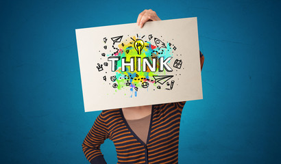 Young person holding paper with design thinking concept 

