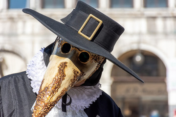 Italy, Venice, 2019, carnival, people with beautiful masks walk around Piazza San Marco, in the...