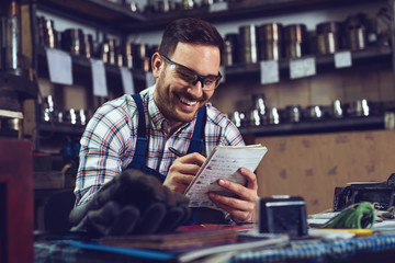 Metallurgy storage facilities worker doing requested inventory