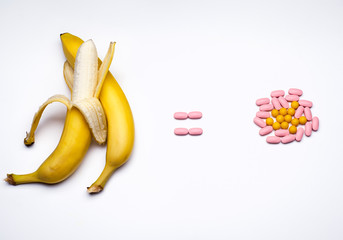 Bananas equal to vitamin pills. Conceptual image of healthy lifestyle