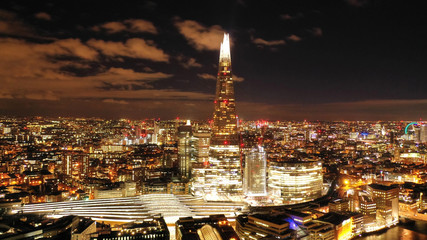 Aerial photo from the Shard at night, iconic building in city district, London, United Kingdom