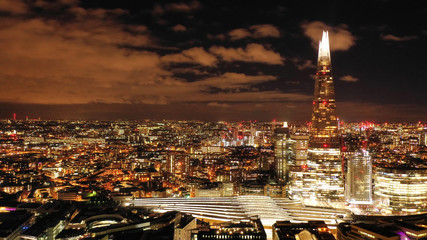 Aerial photo from the Shard at night, iconic building in city district, London, United Kingdom
