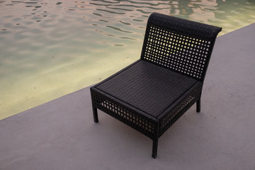 Evening view of Empty chair near water pool