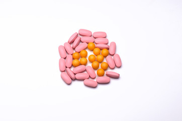 Bunch of vitamin pills isolated on a white background