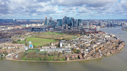 Aerial bird's eye panoramic photo taken by drone of iconic Canary Wharf skyscraper complex and...