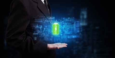 Elegant hand holding battery with full of energy
