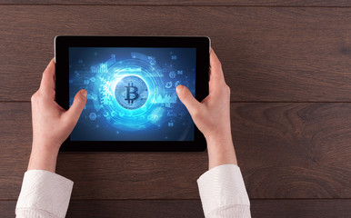 Hand working on tablet with cryptocurrency and network concept
