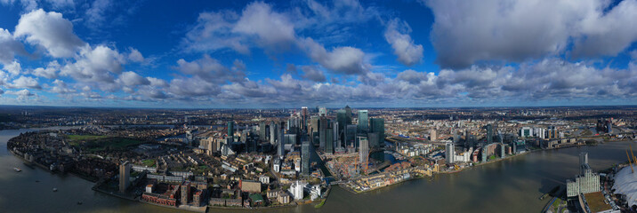 Aerial bird's eye panoramic photo taken by drone of iconic Canary Wharf skyscraper complex and...