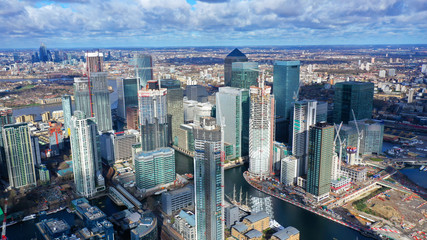 Aerial bird's eye panoramic photo taken by drone of iconic Canary Wharf skyscraper complex and business district, Isle of Dogs, London, United Kingdom