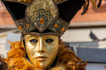 Italy, Venice, carnival 2019, typical masks, beautiful clothes, posing for photographers and tourists.