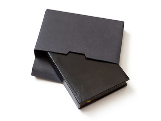 Black book in cardboard box