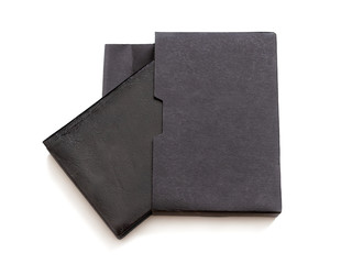 Book with black cover in cardboard box