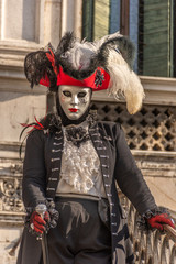 Fototapeta na wymiar Italy, Venice, carnival 2019, typical masks, beautiful clothes, posing for photographers and tourists.