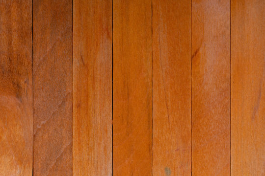 Beautiful texture of natural orange wood slats. Horizontal sense