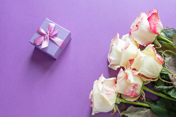 Festive flowers English rose composition on a purple background. Top view, flat lay. Copy space Birthday, mom, valentine, women, wedding day concept