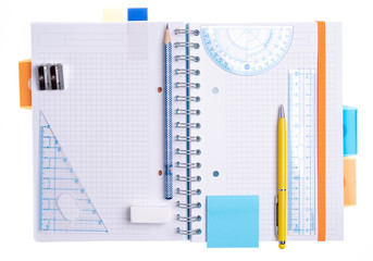  Notebook with office supplies accessories top view isolated on white background