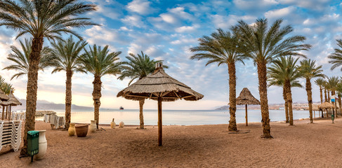 Morning on central public beach of Eilat - famous tourist resort and recreational city in Israel and Middle East, Panoramic image
