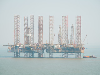 Offshore jack-up drilling rig and gas production platform in Indian waters. 