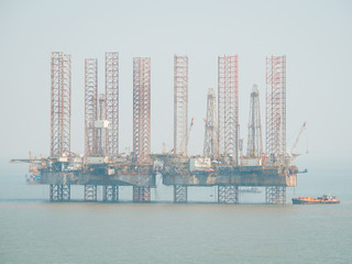 Offshore jack-up drilling rig and gas production platform in Indian waters. 