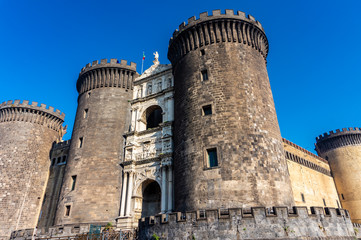 Fototapeta na wymiar Medieval castle Maschio Angioino in a summer day in Naples