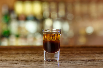 Cocktail shot with whiskey on the bar