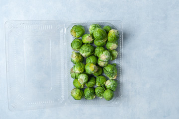 Fresh Brussels sprouts in a plastic container