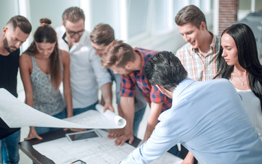 Fototapeta premium group of designers are discussing a new creative project