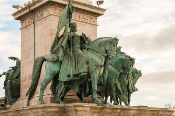 Obraz premium The seven chieftains in Heroes’ Square in Budapest, Hungary. The sculptures were made by sculptor Zala Gyorgy from Lendava in 1896 in Budapest.