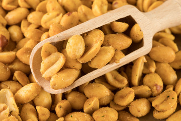 close up wooden spoon with peanuts