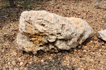 Calcite stone : is a carbonate mineral and the most stable polymorph of calcium carbonate, on ground field.