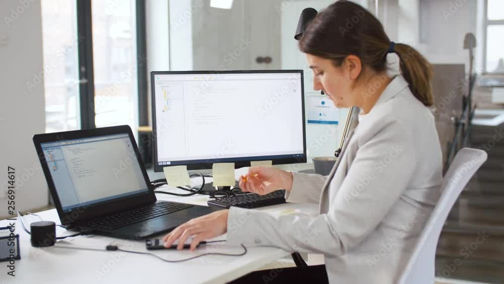 Poster business, programming and technology concept - programmer or businesswoman with smartphone, notebook
