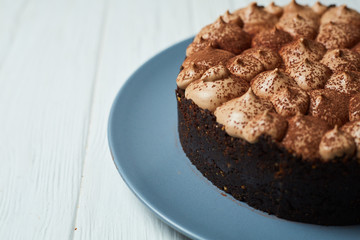 Vanilla cheesecake with milk chocolate cream and cocoa