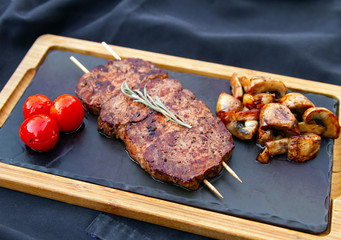 brochet grilled veal with mushrooms and grilled tomatoes