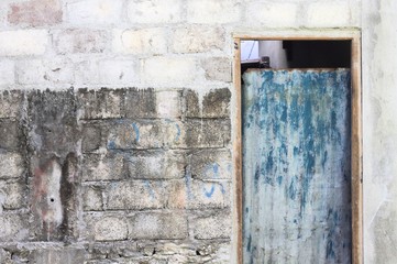 Blue metallic door - Entrance of an abandoned house (Ari Atoll, Maldives)