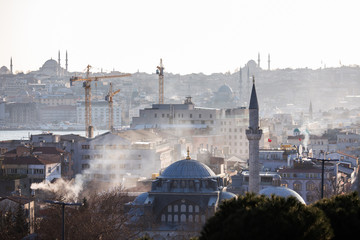 Obraz premium Photo of domed buildings, industrial buildings, cranes, sky