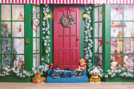 Men's shoes on the New Year decorations. Different shoes for Christmas background. Gifts for men and boys. Take off your shoes in the house. Boots on the doorstep. - Powered by Adobe