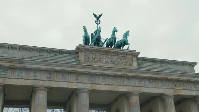 Slow Motion Close-up of horses at the Brandenburg Gate restoration. In the capital of Germany, Berlin. The concept of Hitler's Third Reich and Nazism.